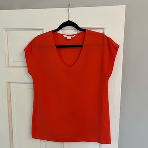 Diane Von Furstenburg orange top, size Small